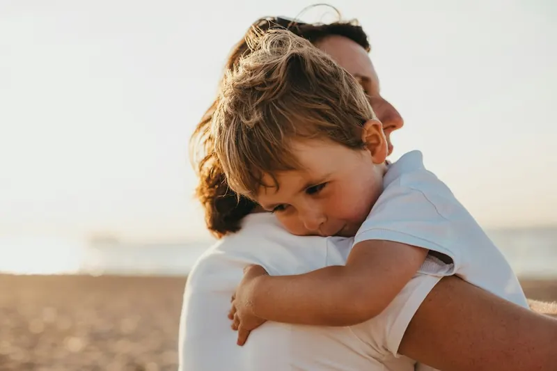An illustrative photograph of a parent and child